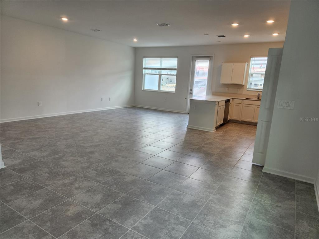 203 Bogey Drive Davenport, FL 33896 - Photo 11 of 41 a view of an empty room with window and cabinet