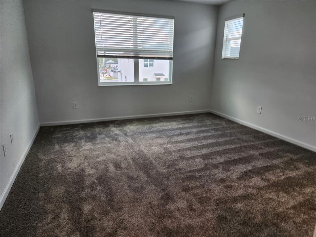 203 Bogey Drive Davenport, FL 33896 - Photo 18 of 41 an empty room with windows
