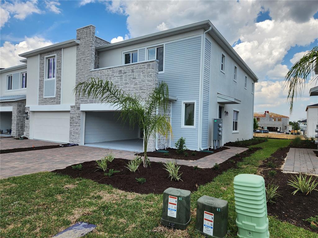 203 Bogey Drive Davenport, FL 33896 - Photo 2 of 41 a front view of a house with garden