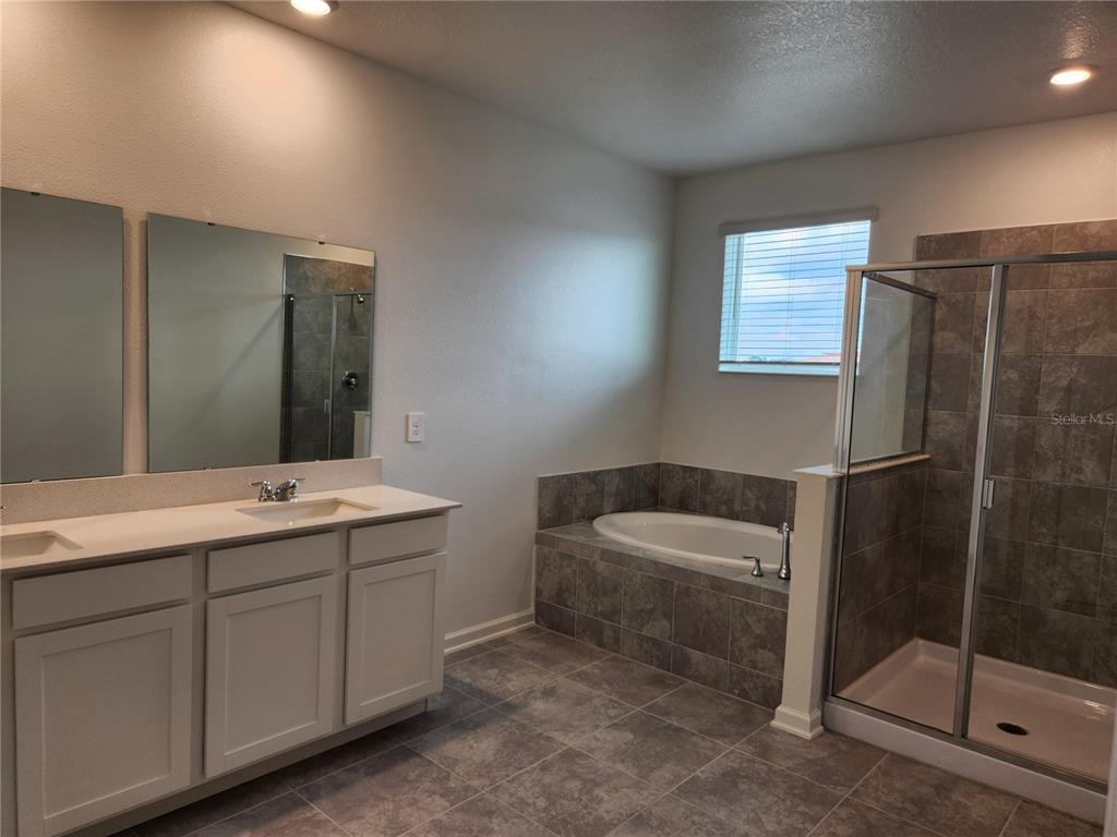 203 Bogey Drive Davenport, FL 33896 - Photo 22 of 41 a bathroom with a sink a toilet and shower