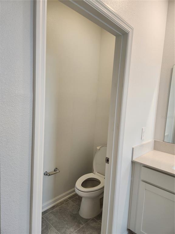 203 Bogey Drive Davenport, FL 33896 - Photo 26 of 41 a bathroom with a toilet