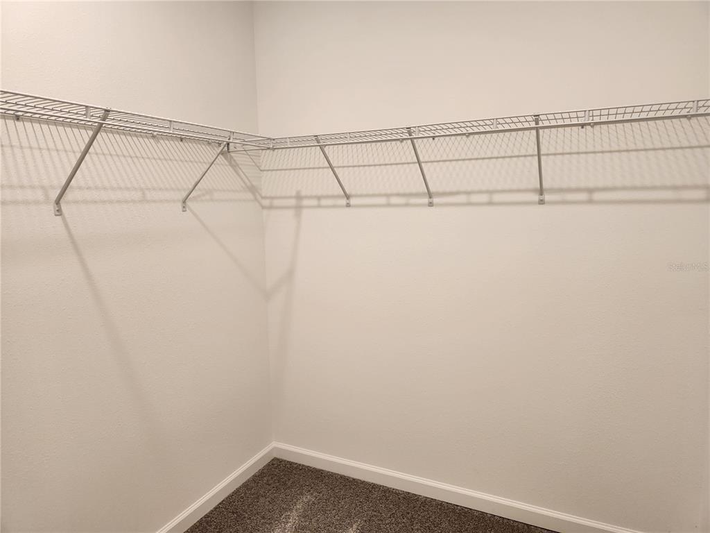 203 Bogey Drive Davenport, FL 33896 - Photo 27 of 41 a view of a room with racks on the wall