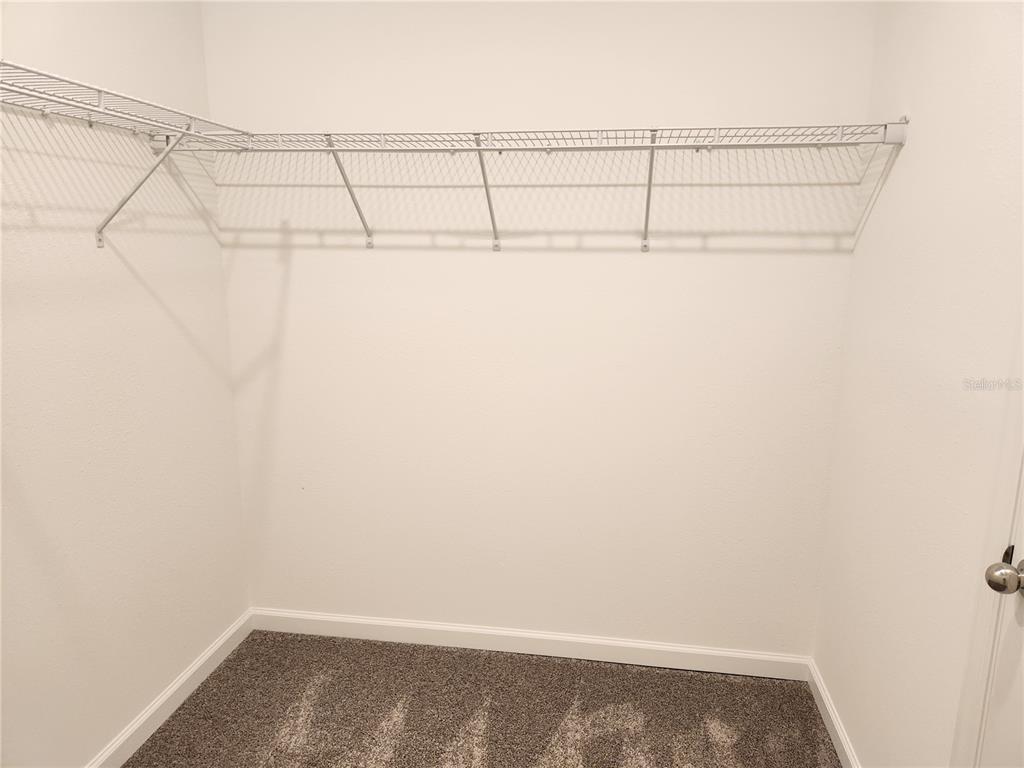 203 Bogey Drive Davenport, FL 33896 - Photo 29 of 41 a view of a room with racks on the wall