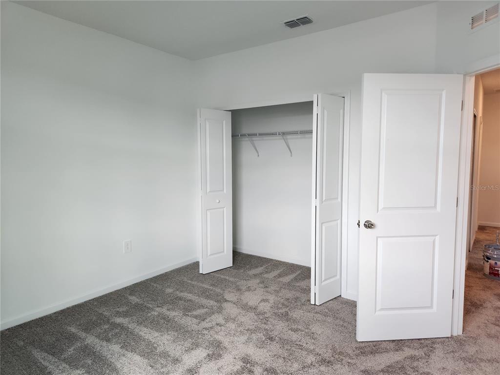 203 Bogey Drive Davenport, FL 33896 - Photo 30 of 41 a view of an empty room and closet area