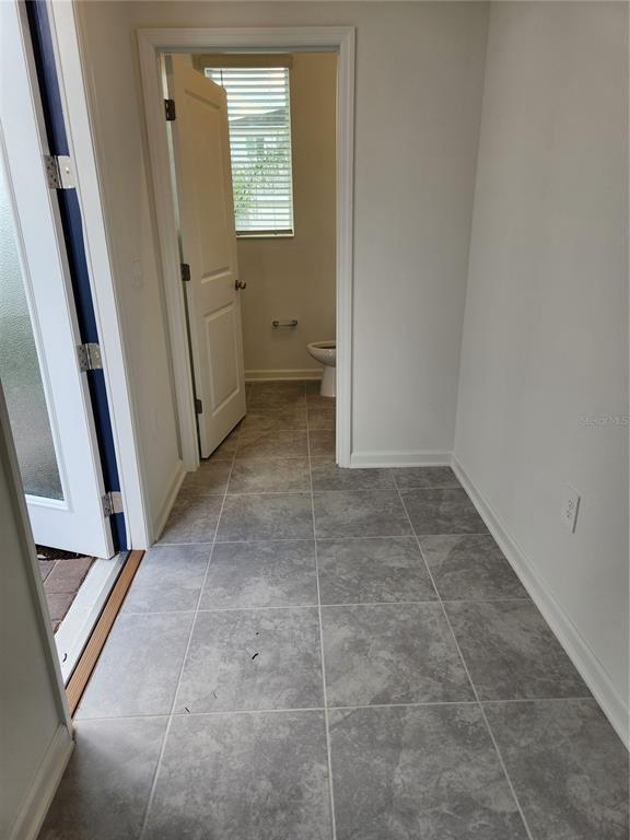 203 Bogey Drive Davenport, FL 33896 - Photo 3 of 41 a view of room with window and hardwood floor