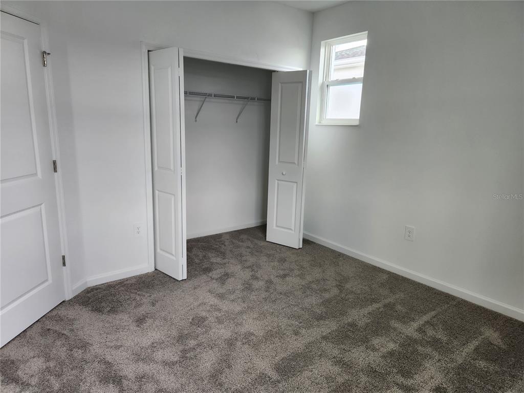 203 Bogey Drive Davenport, FL 33896 - Photo 31 of 41 an empty room with windows and closet