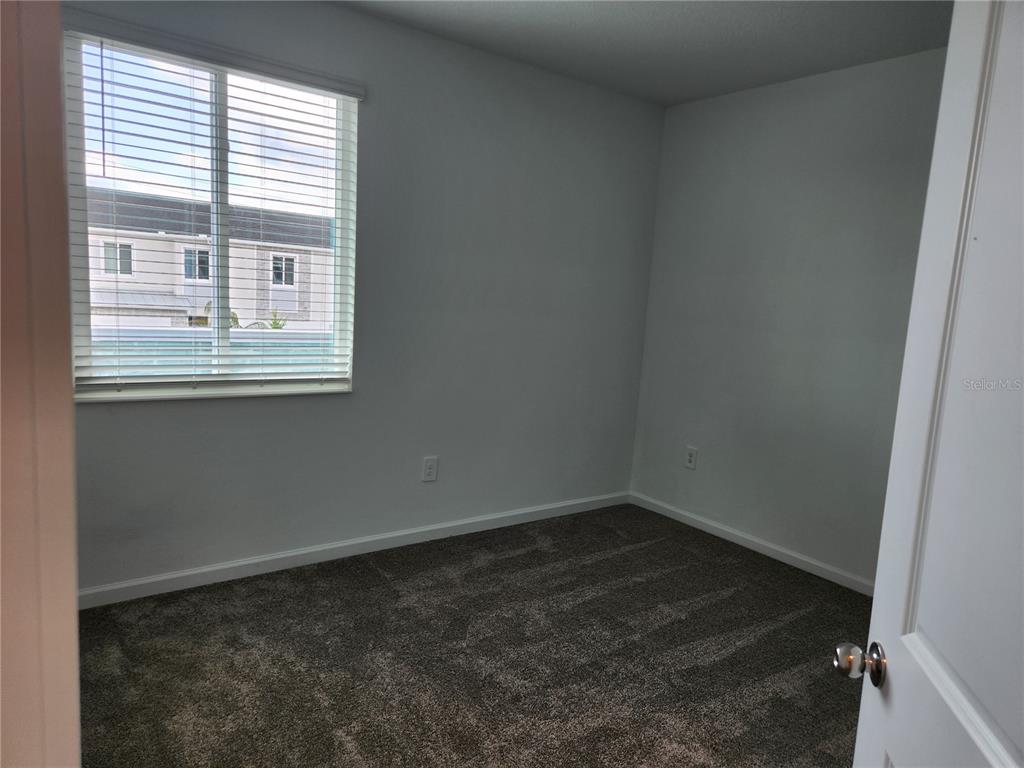 203 Bogey Drive Davenport, FL 33896 - Photo 33 of 41 a room that has a window in it