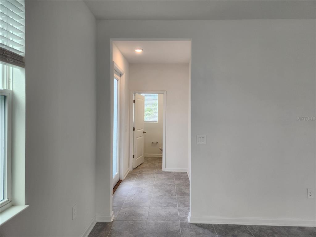 203 Bogey Drive Davenport, FL 33896 - Photo 5 of 41 a view of a hallway with a room