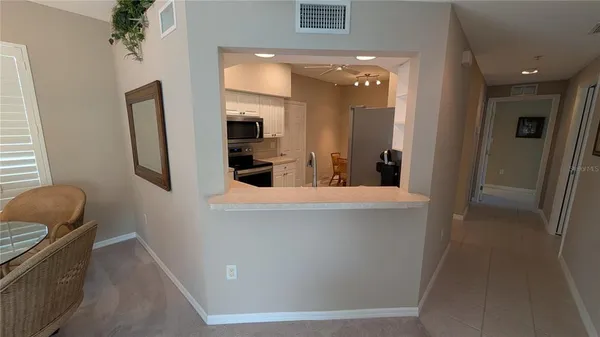 a living room with furniture and a mirror