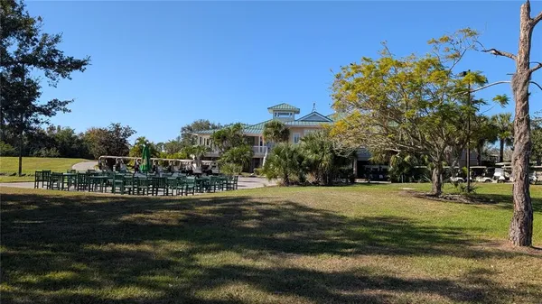 a view of a park with large trees