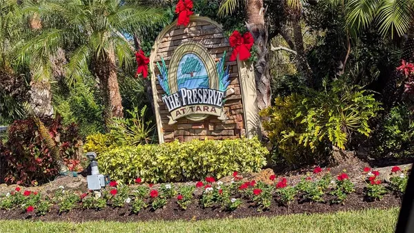 a view of front of flowers and covered with wooden fence