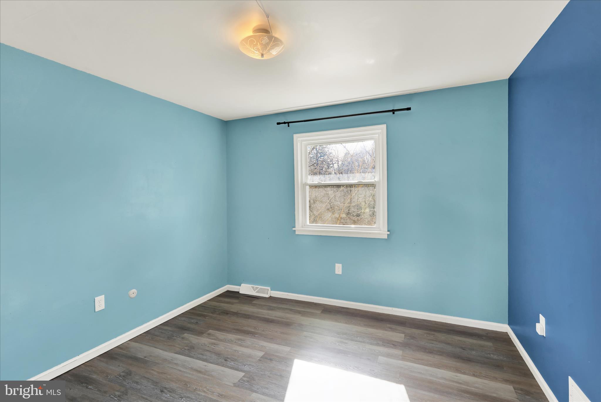 302 South Tulpehocken Road Reading, PA 19601 - Photo 29 of 44 an empty room with wooden floor and windows