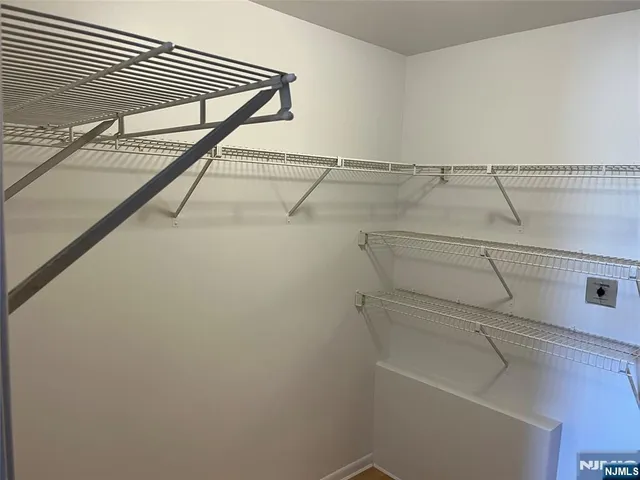 a view of a room with racks on the wall