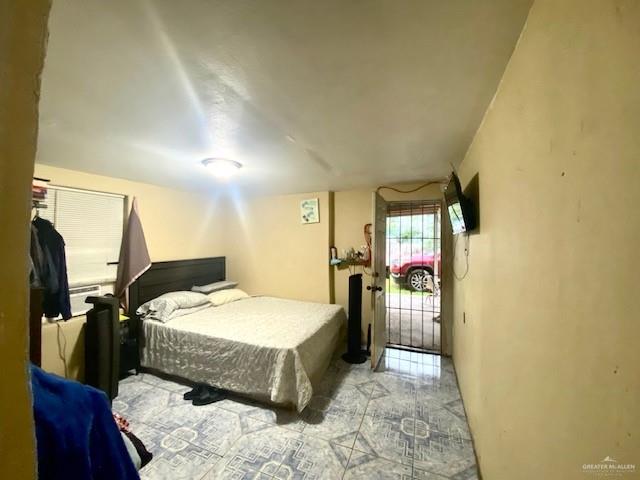 5910 Alpine Avenue Mission, TX 78574 - Photo 9 of 15 a bed room with a bed and a chair