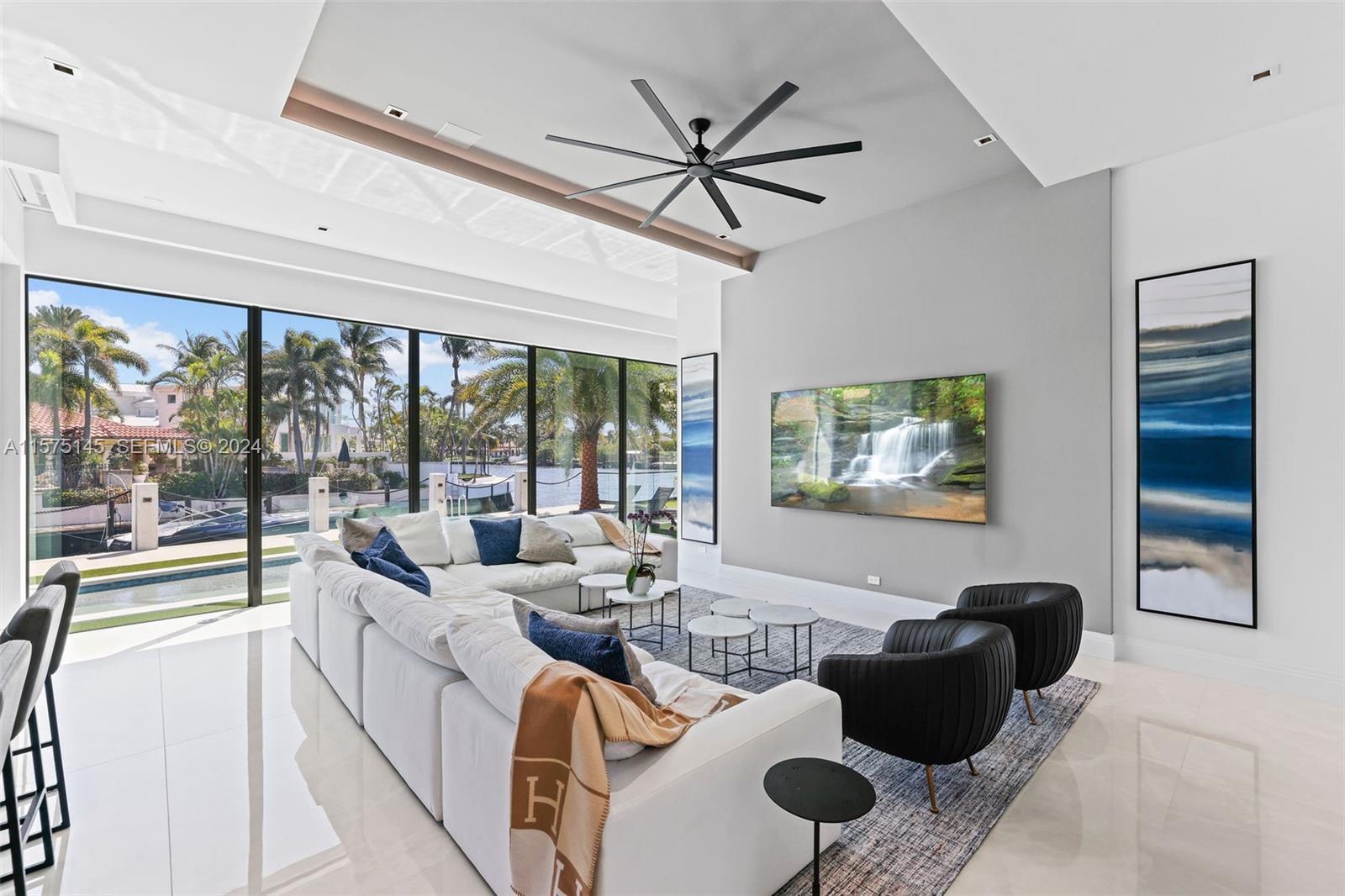 749 Bamboo Drive Boca Raton, FL 33432 - Photo 17 of 91 a living room with furniture and a large window