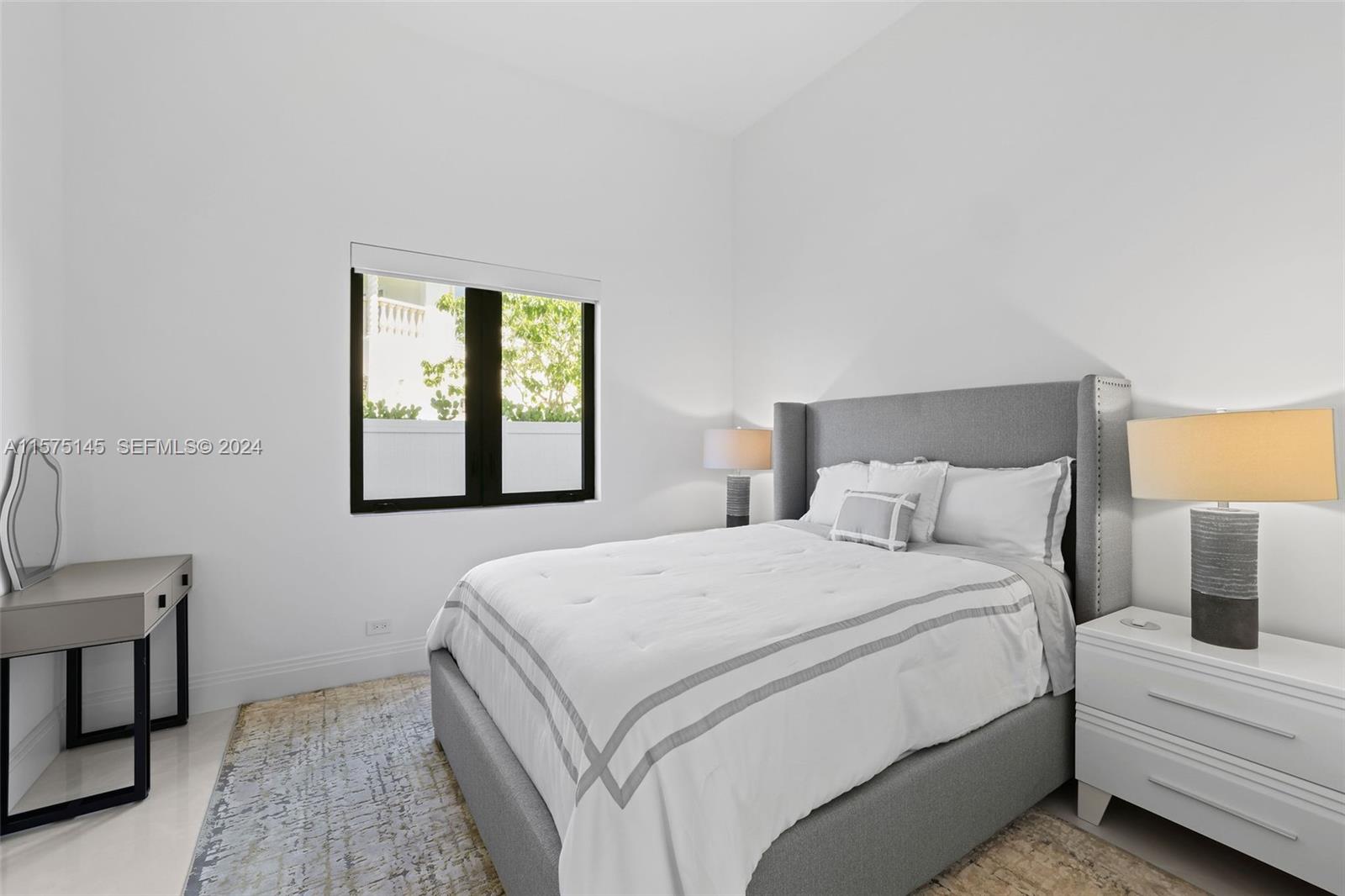 749 Bamboo Drive Boca Raton, FL 33432 - Photo 26 of 91 a bedroom with a bed and a window