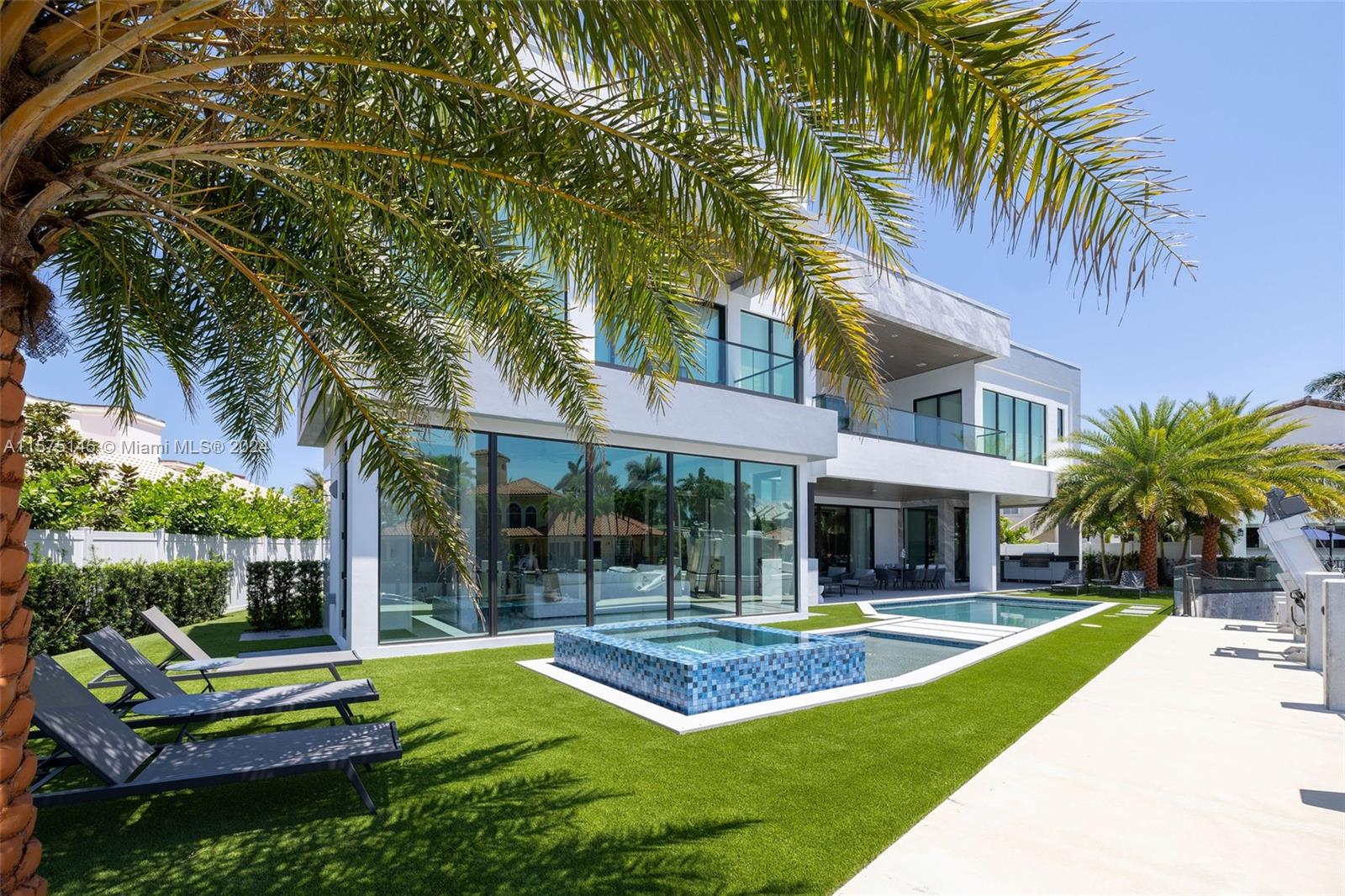 749 Bamboo Drive Boca Raton, FL 33432 - Photo 67 of 91 a view of a house with swimming pool and sitting area