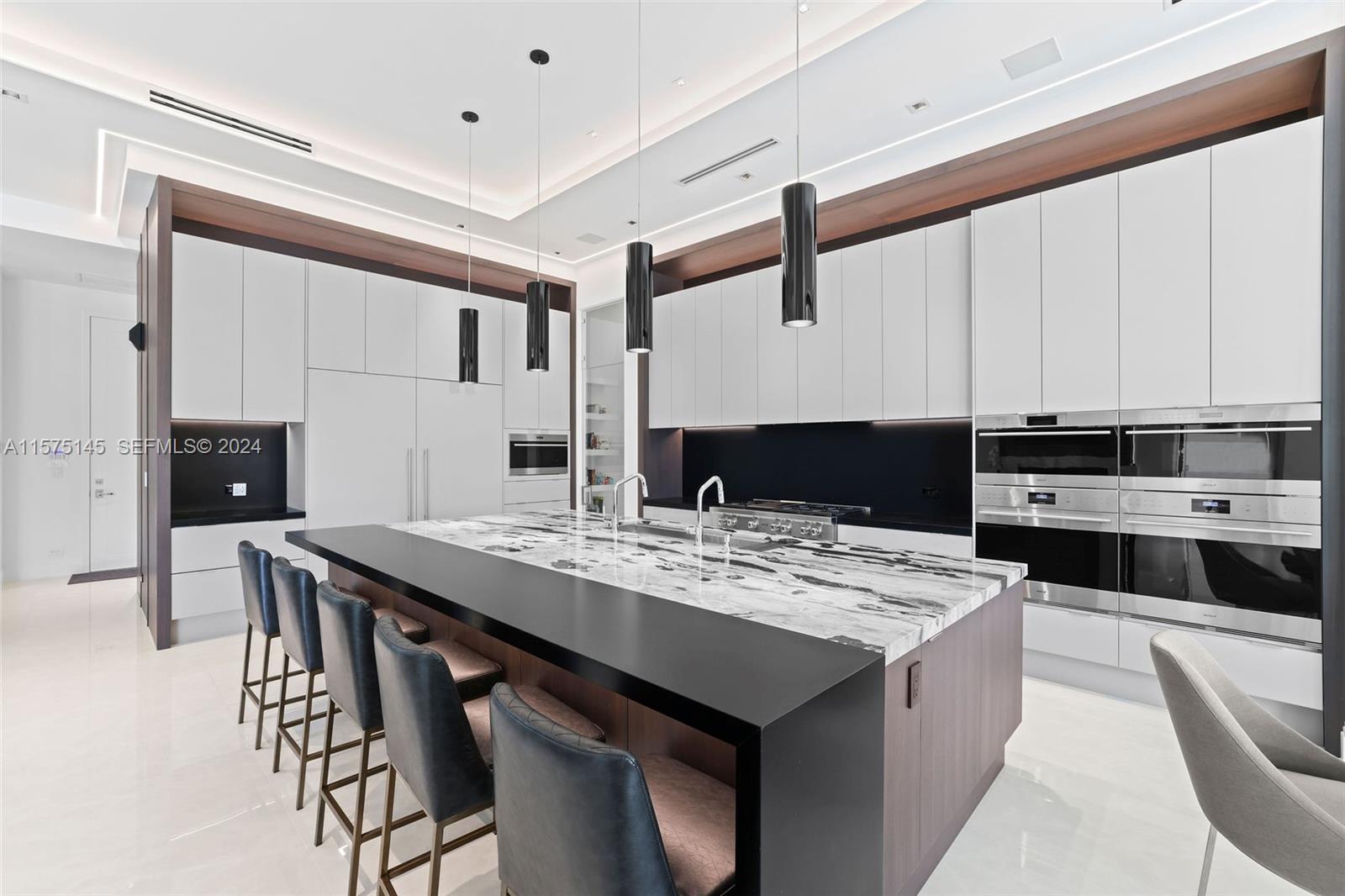 749 Bamboo Drive Boca Raton, FL 33432 - Photo 10 of 91 a kitchen with a stove a sink and a refrigerator