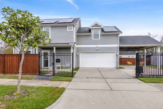 a front view of a house with a garage