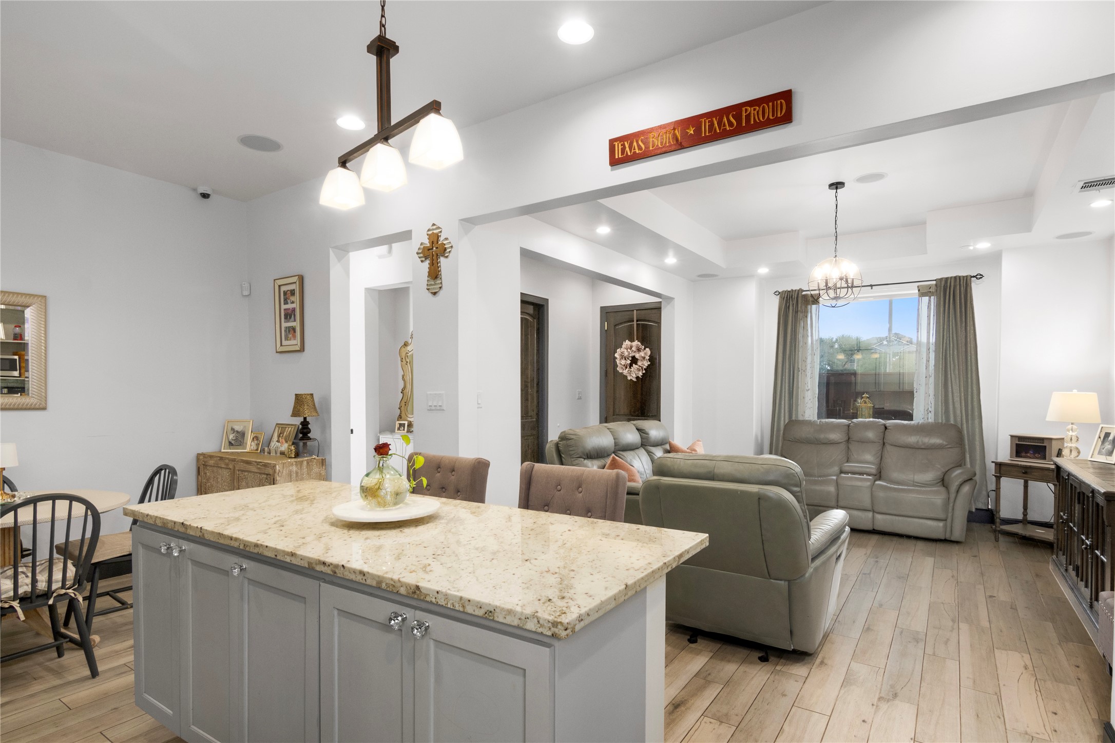 7341 Ave East Houston, TX 77011 - Photo 11 of 33 a large living room with granite countertop couches a fireplace with wooden floor