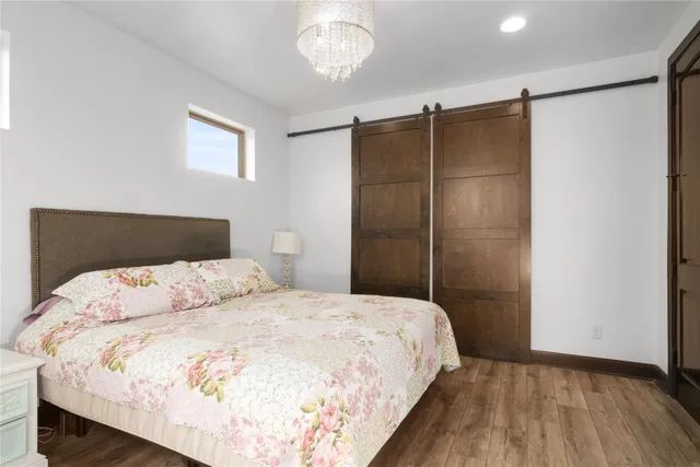 a bedroom with a bed and a table