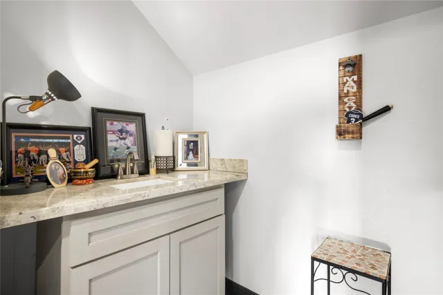 a living room with granite countertop furniture and a fireplace