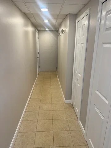 a bathroom with a sink toilet and mirror