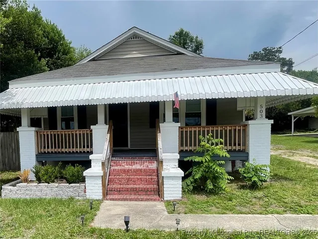 a front view of a house with a porch