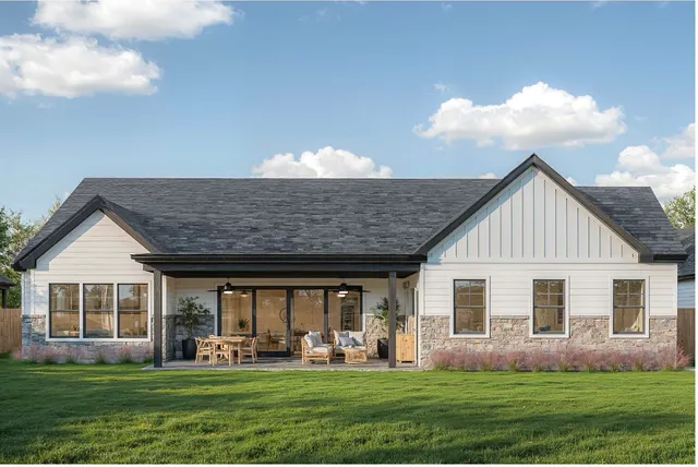a front view of house with yard outdoor seating and green space