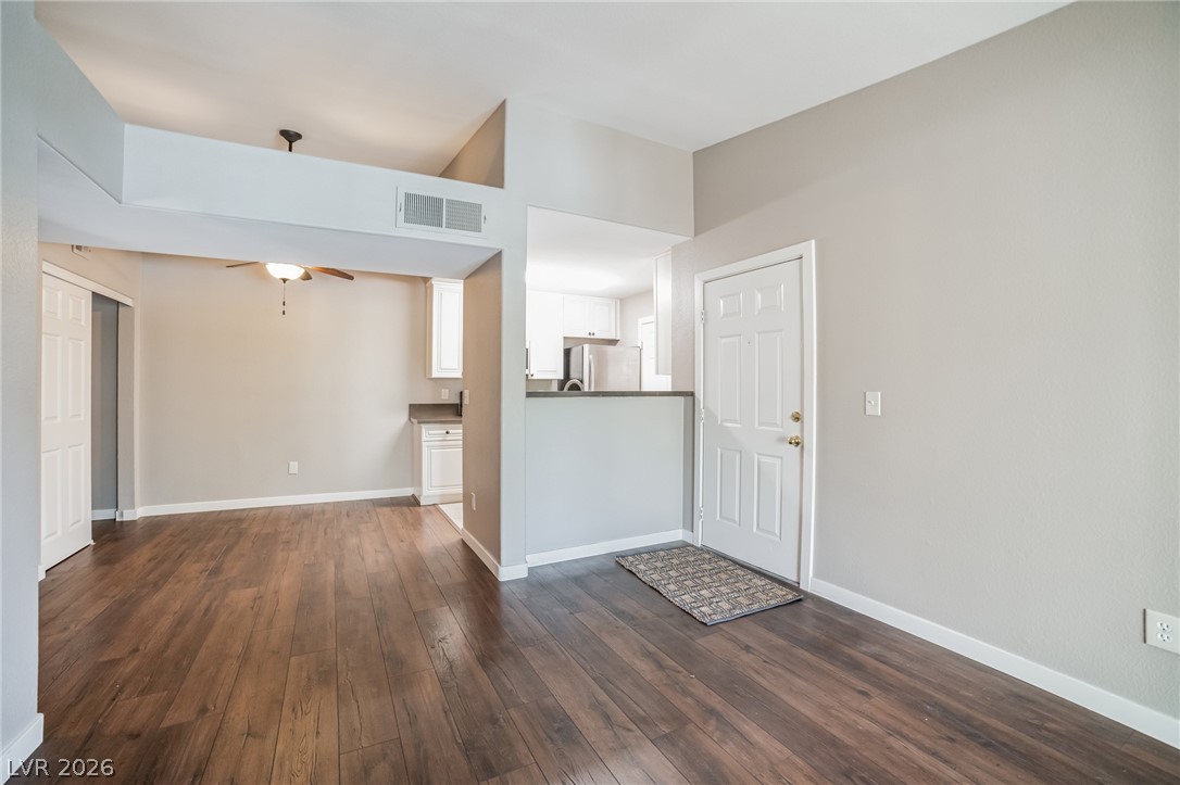 7885 West Flamingo Road, Unit 2041 Las Vegas, NV 89147 - Photo 5 of 14 Foyer entrance with dark wood finished floors and a ceiling fan