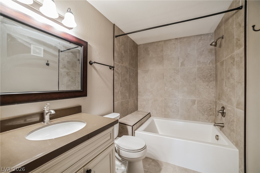 7885 West Flamingo Road, Unit 2041 Las Vegas, NV 89147 - Photo 10 of 14 Bathroom with bathtub / shower combination and vanity