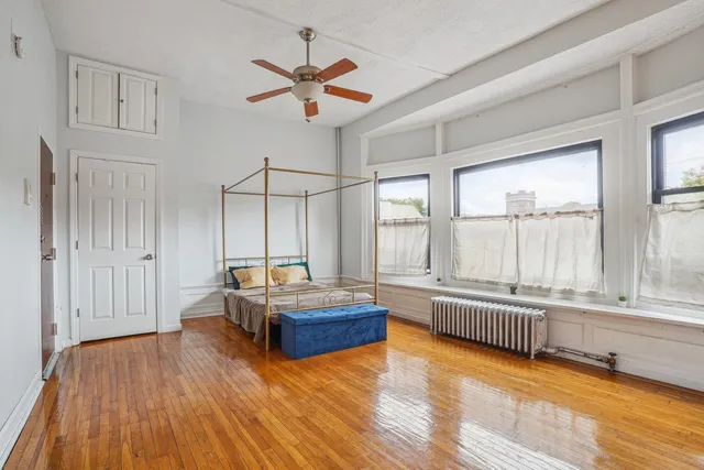 a living room with furniture and windows