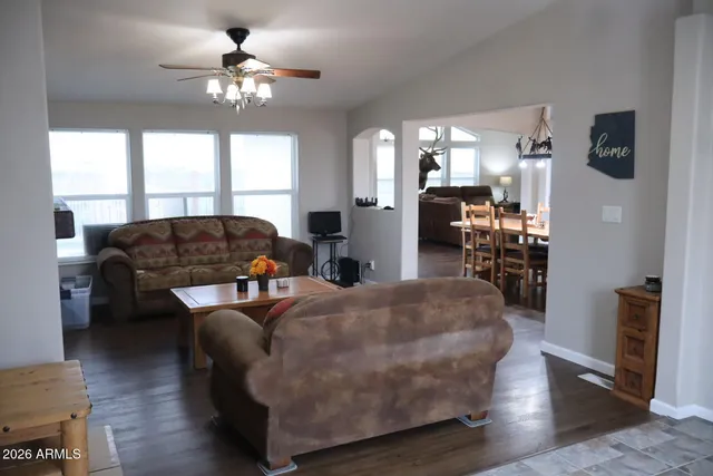 a living room with furniture and a large window