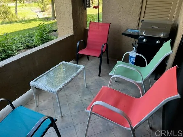 a view of balcony with furniture