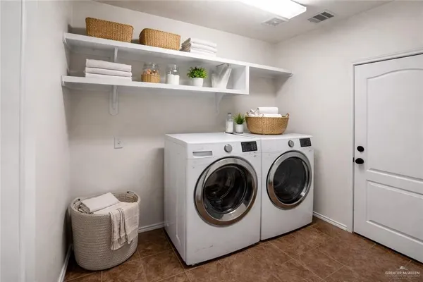 a utility room with cabinets