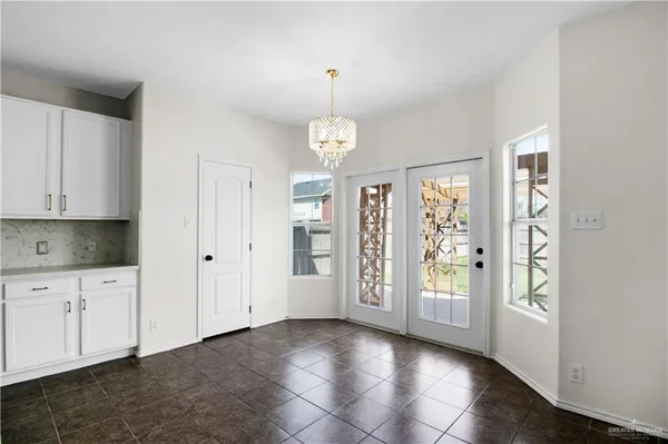 a kitchen with stainless steel appliances granite countertop a sink and cabinets