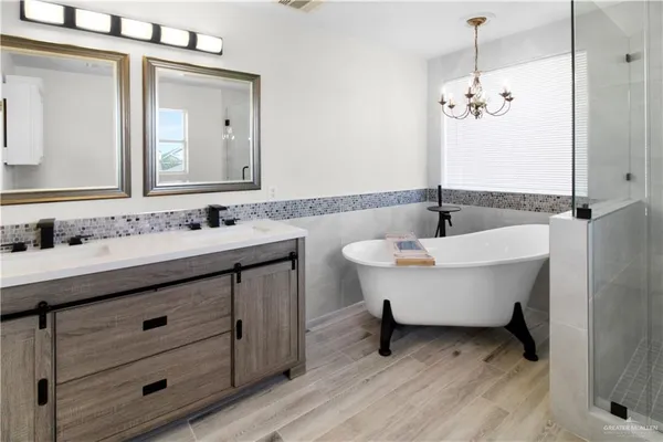 a bathroom with a double vanity sink and a mirror
