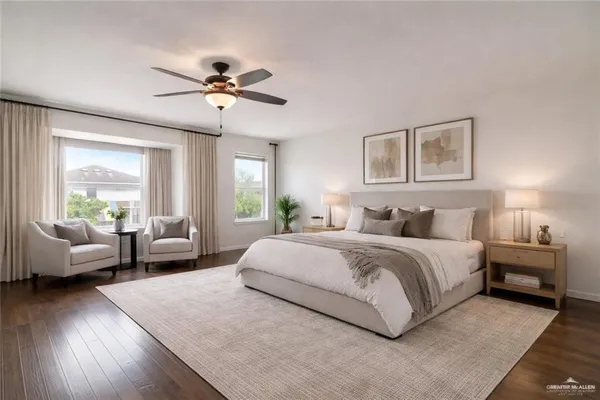 a spacious bedroom with a bed a couch and a couch