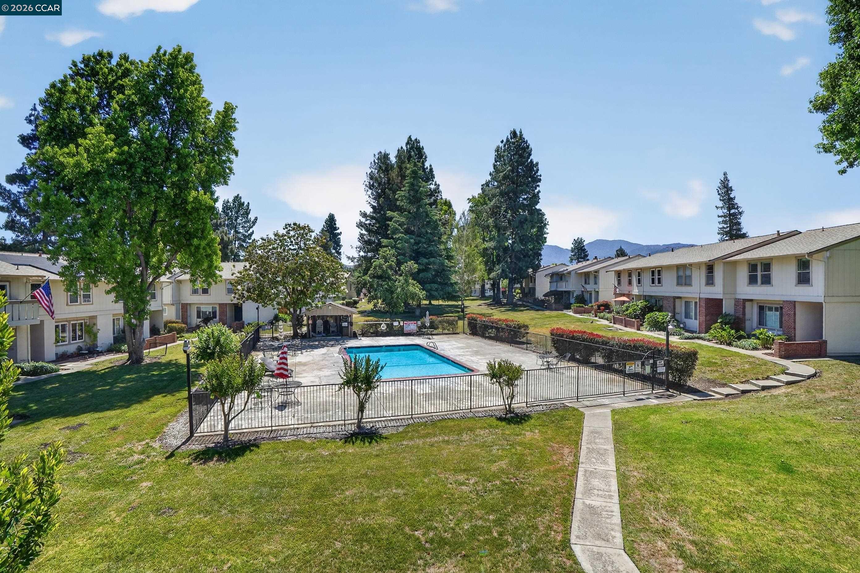 1812 Wildbrook Court, Unit C Concord, CA 94521 - Photo 27 of 35 a house view with a sitting space and garden
