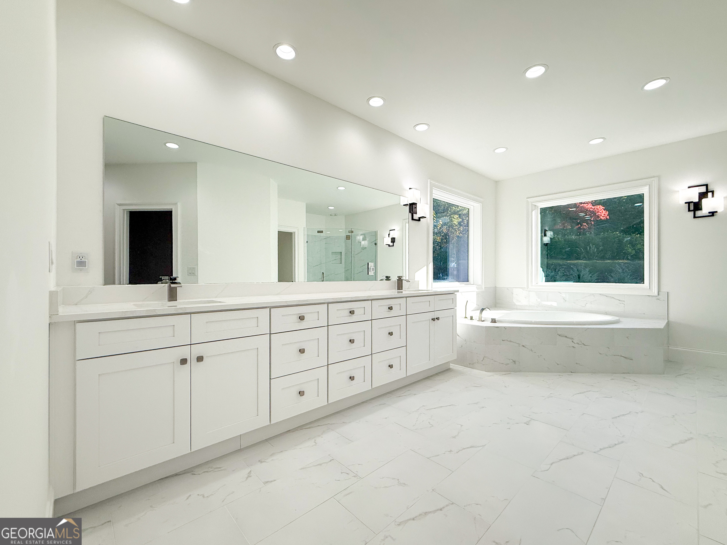 2125 Goat Neck Road Cleveland, GA 30528 - Photo 15 of 24 a spacious bathroom with a large mirror vanity and bathtub