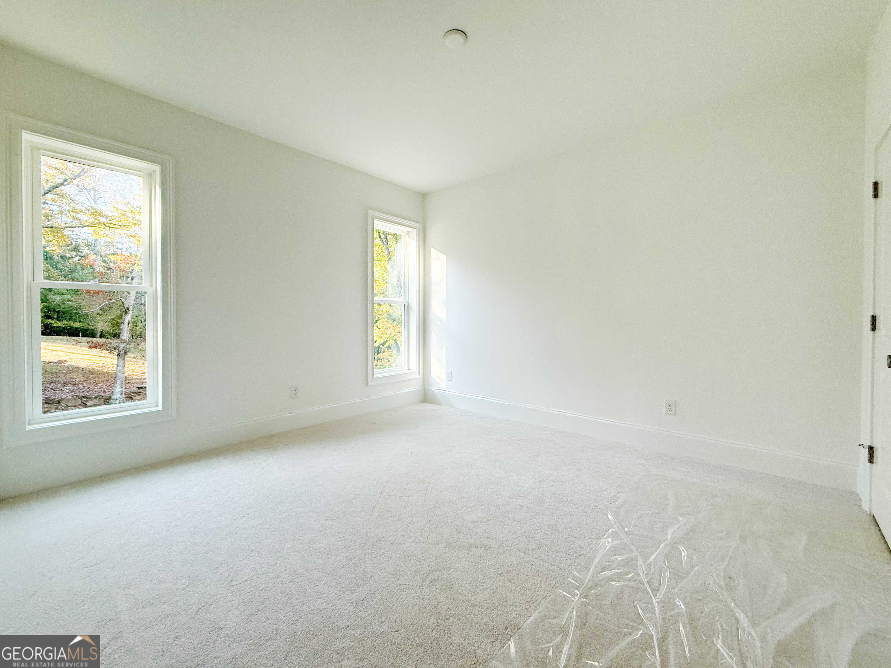 2125 Goat Neck Road Cleveland, GA 30528 - Photo 20 of 24 an empty room with windows