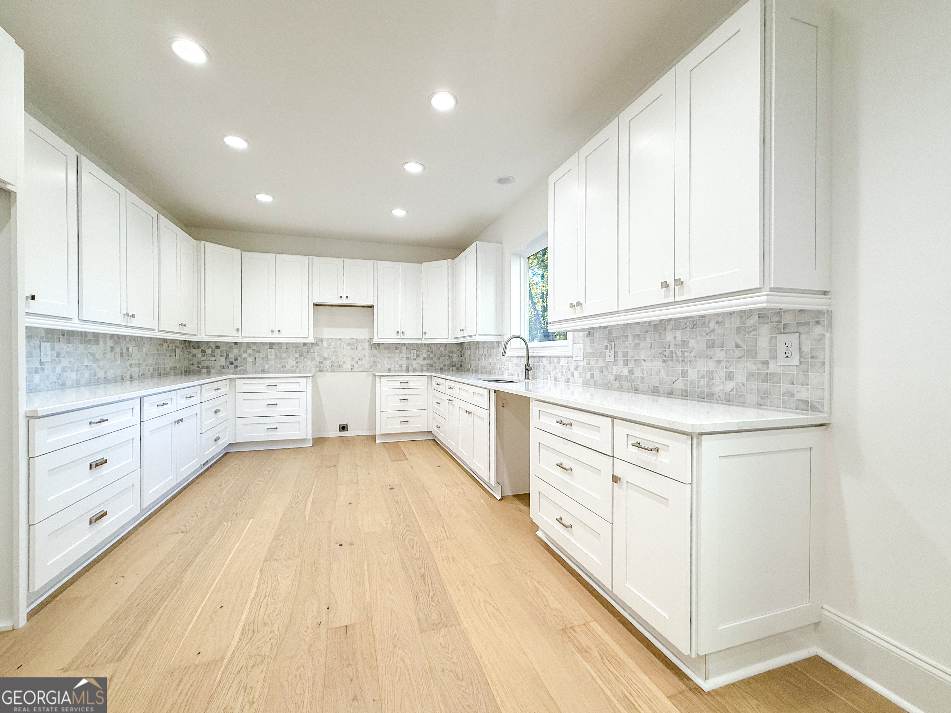 2125 Goat Neck Road Cleveland, GA 30528 - Photo 9 of 24 a kitchen with granite countertop white cabinets and white appliances