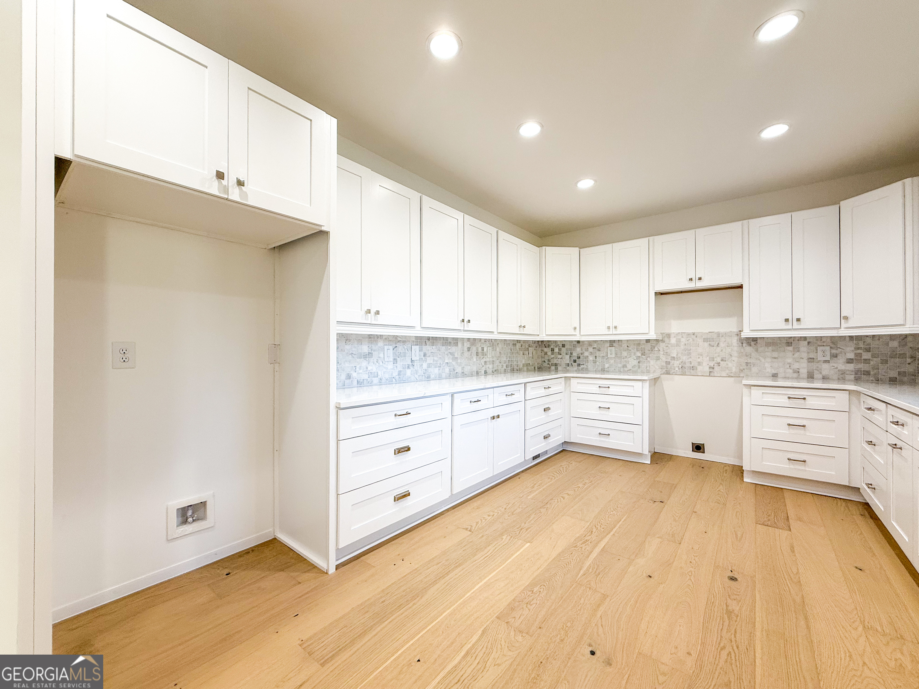 2125 Goat Neck Road Cleveland, GA 30528 - Photo 10 of 24 a kitchen with granite countertop white cabinets and white appliances