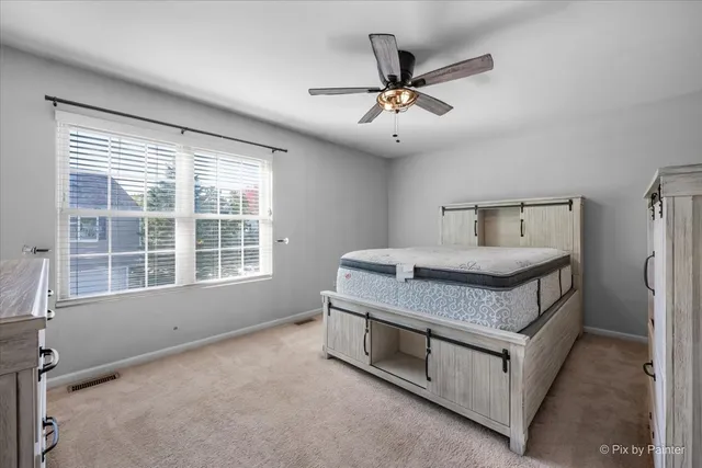 a living room with furniture and windows