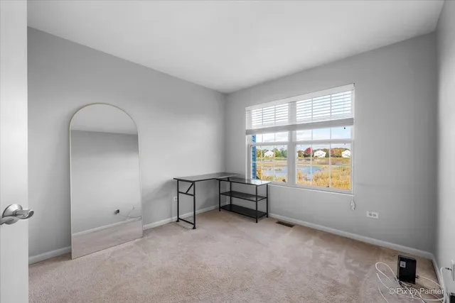 a view of room with window and workspace