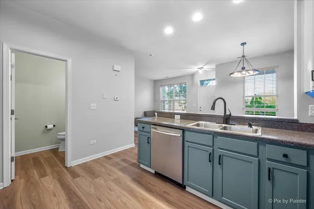 a spacious bathroom with a granite countertop sink a mirror and a shower