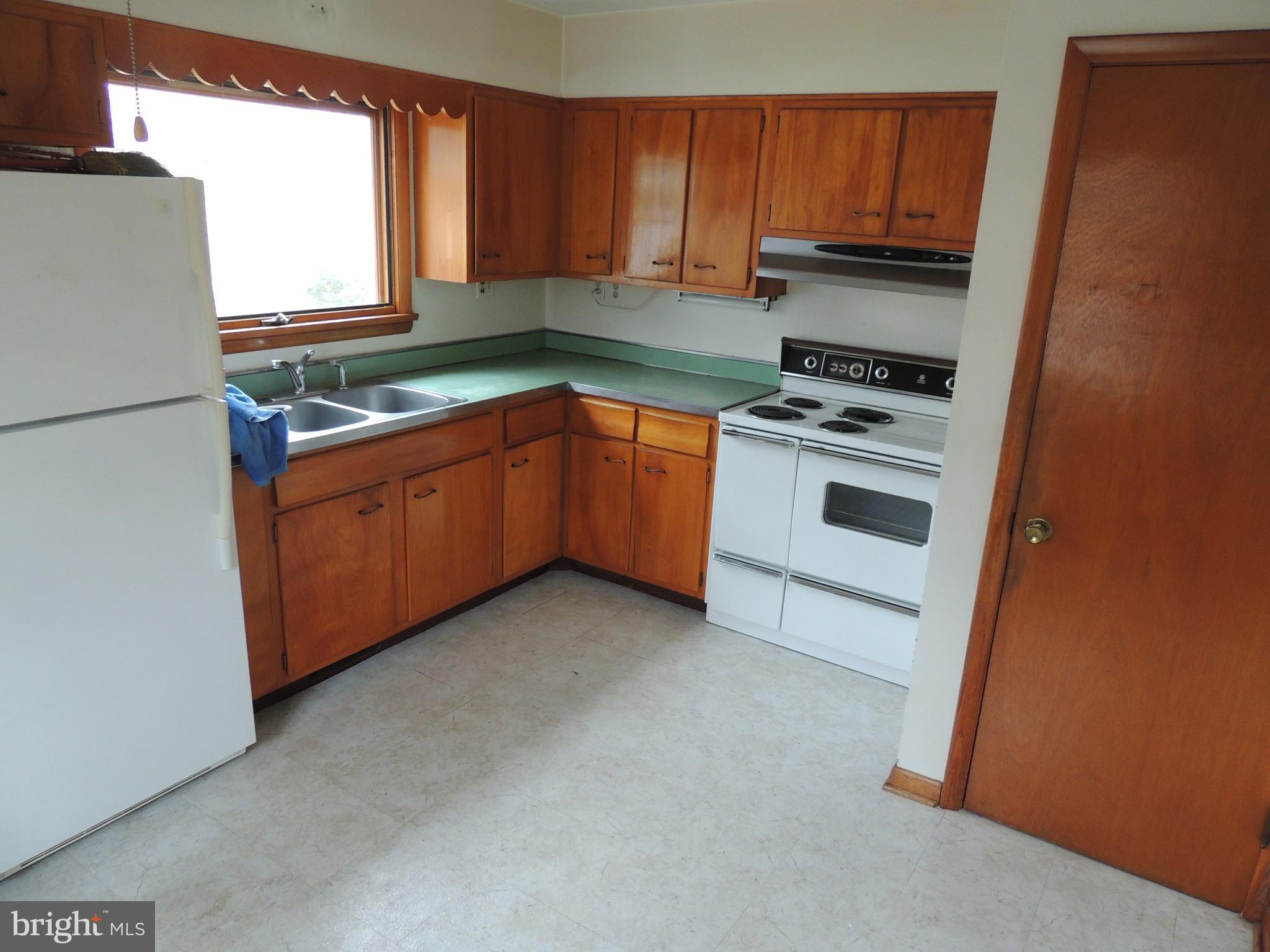1115 Vale Road Bel Air, MD 21014 - Photo 8 of 12 a kitchen with stainless steel appliances a refrigerator sink and stove