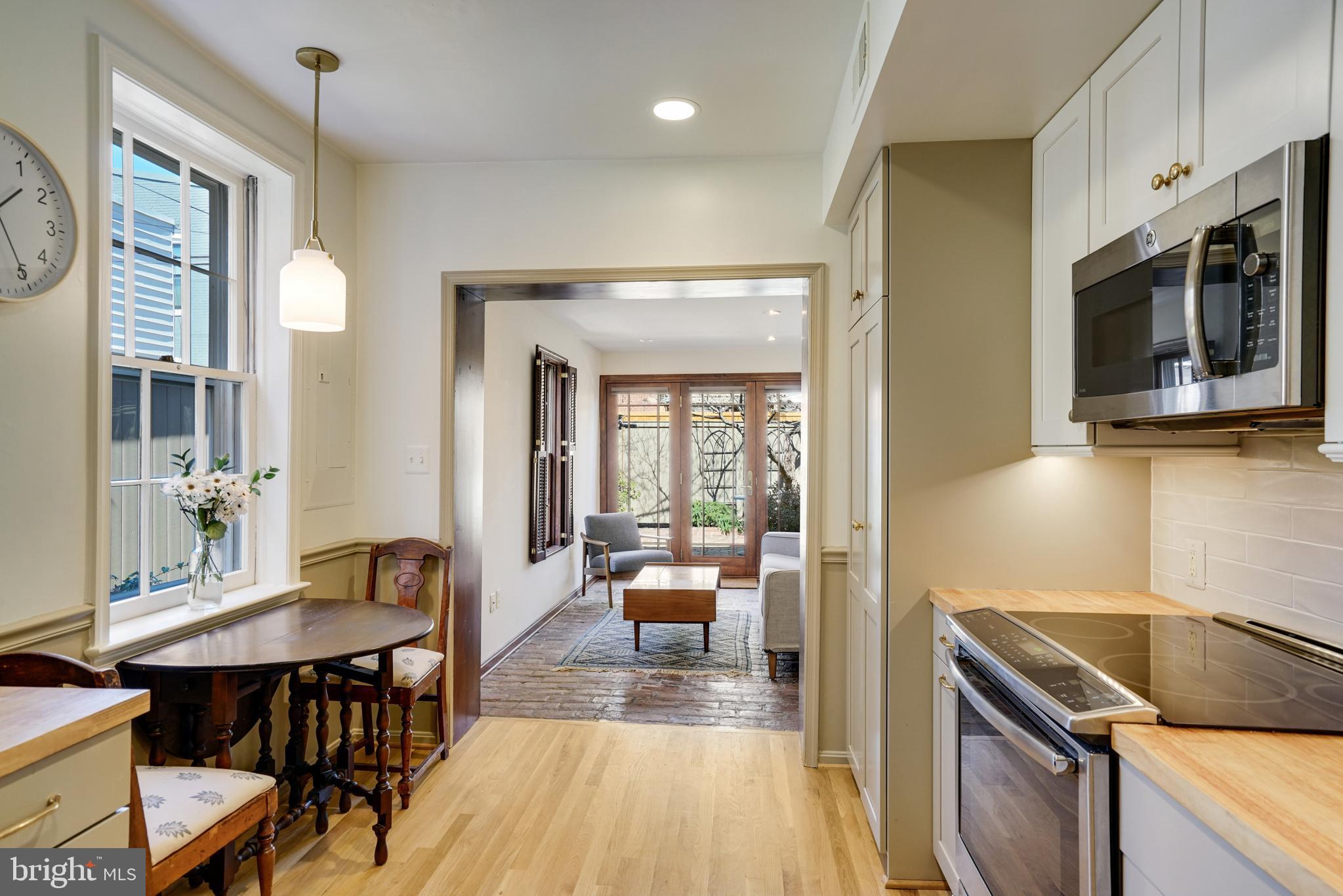 817 Duke Street Alexandria, VA 22314 - Photo 16 of 39 a kitchen with a table chairs and entryway