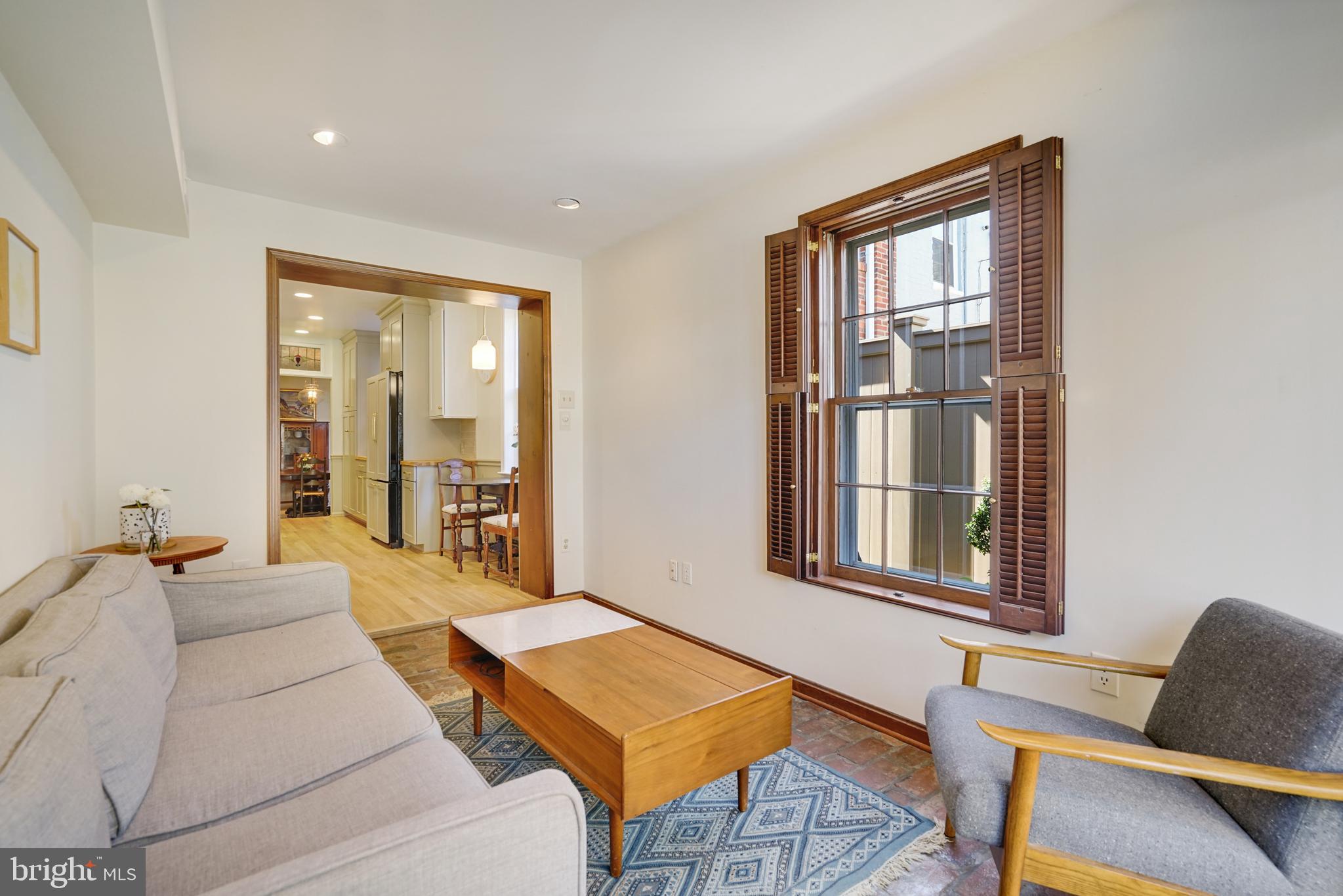 817 Duke Street Alexandria, VA 22314 - Photo 20 of 39 a living room with furniture and a window
