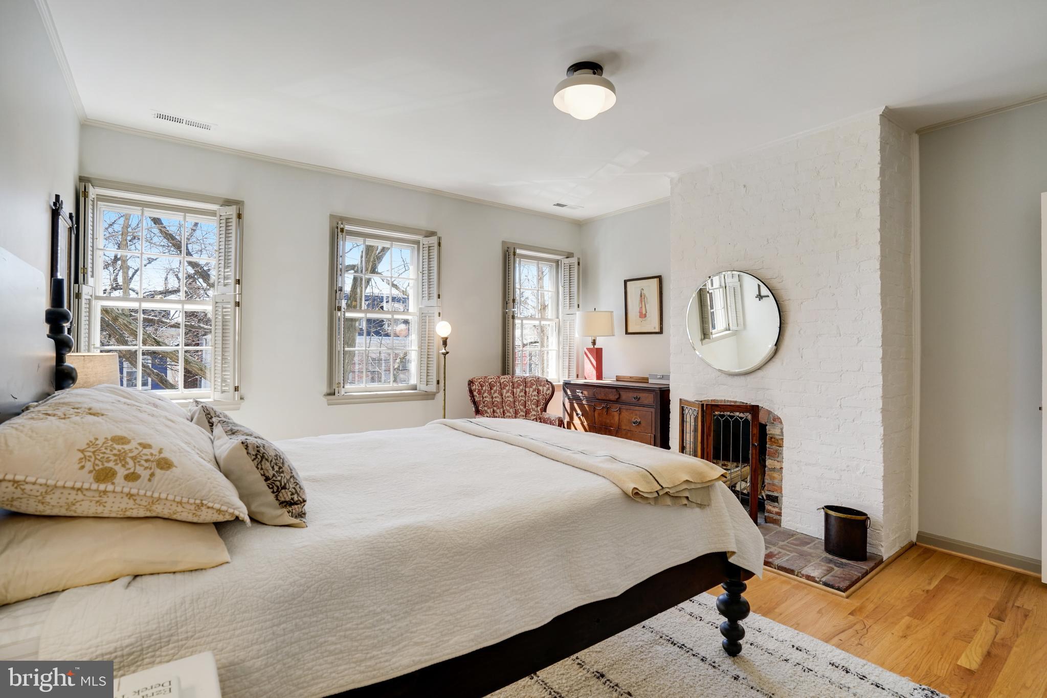 817 Duke Street Alexandria, VA 22314 - Photo 24 of 39 a bedroom with bed and a window